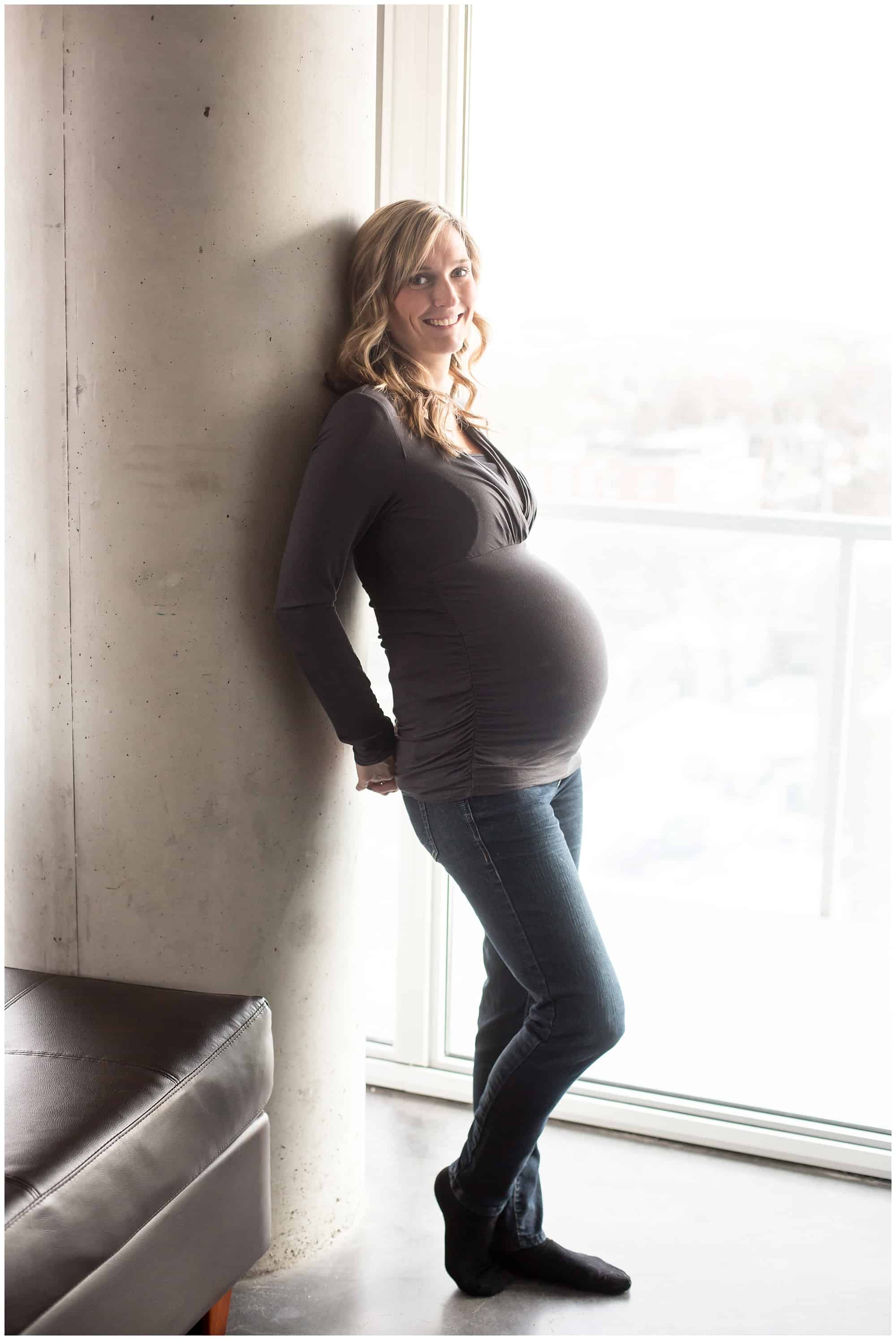 very round pregnant belly in a condo in Toronto.