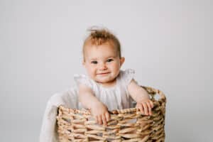 baby in a wicker basket