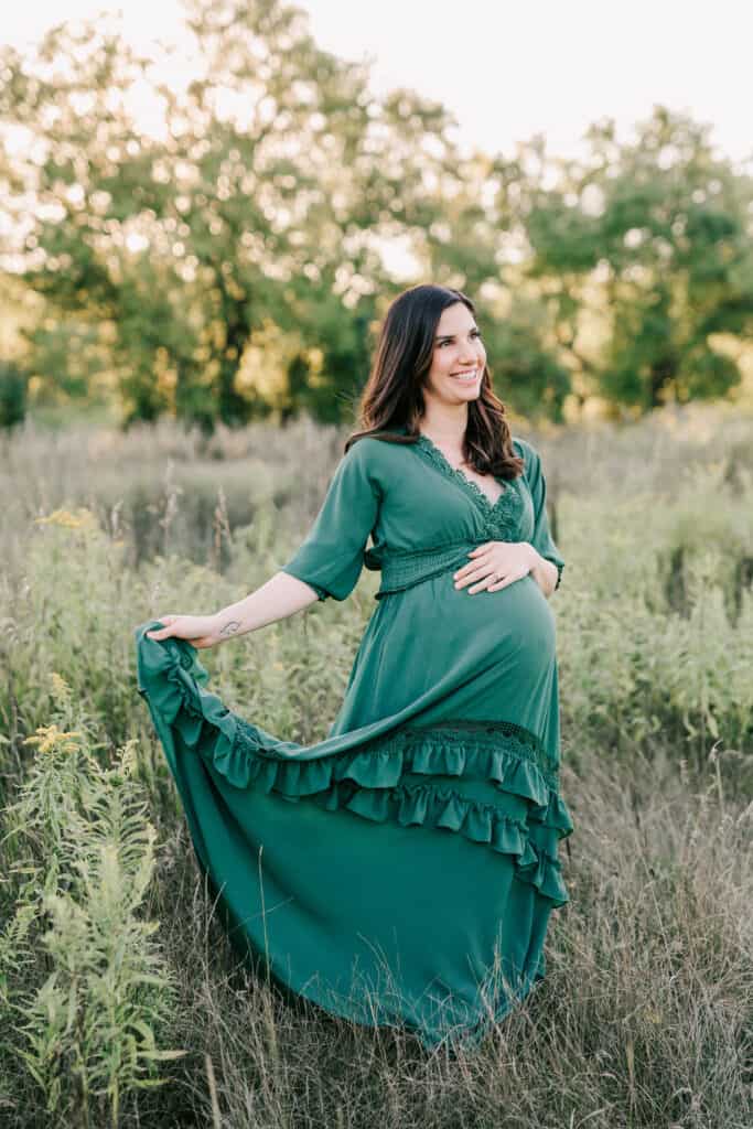 mom to be in green maternity gown in a field Guelph Community Health Centre
